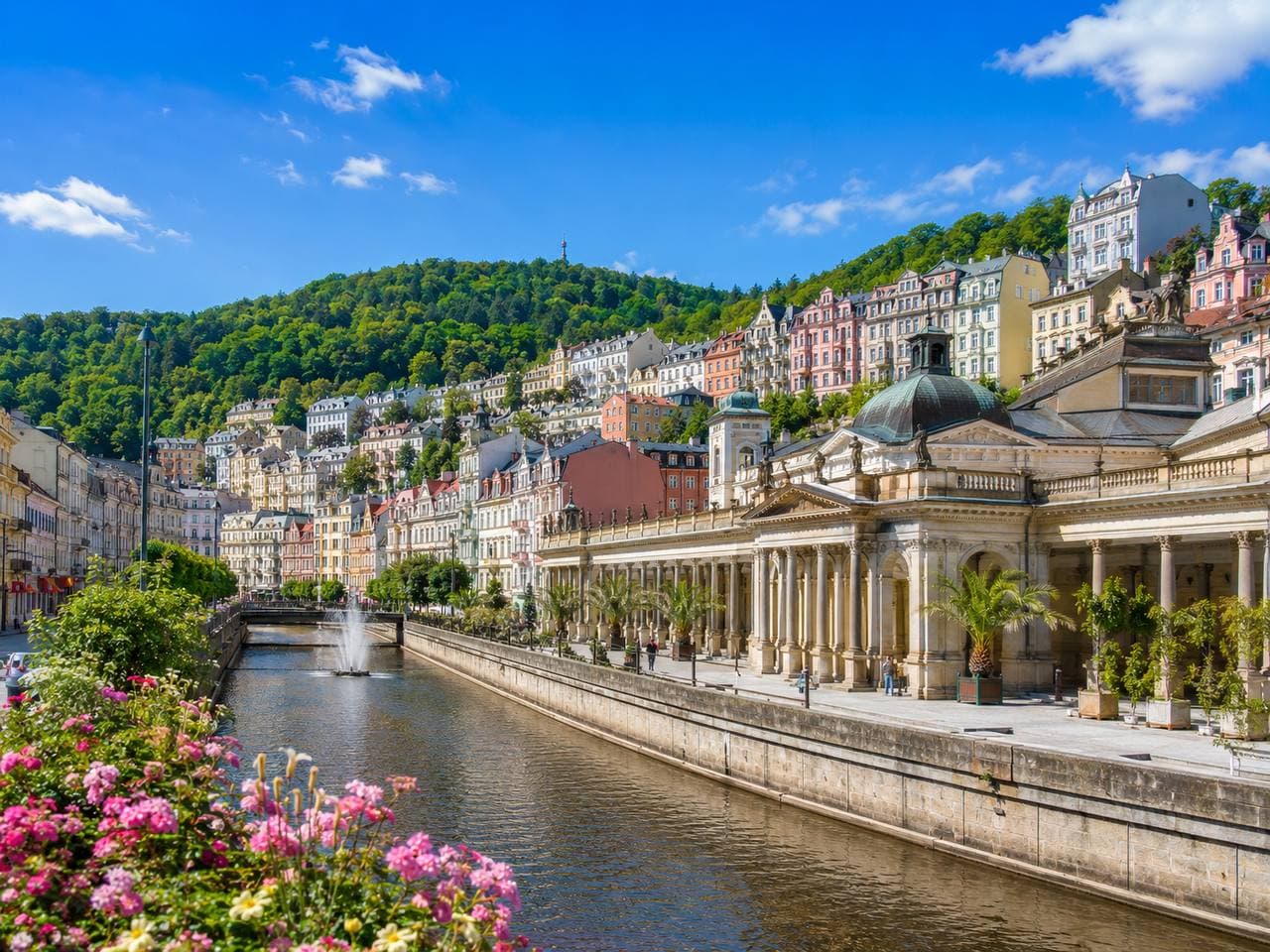 Karlovy Vary spa colonnade and colourful riverside buildings